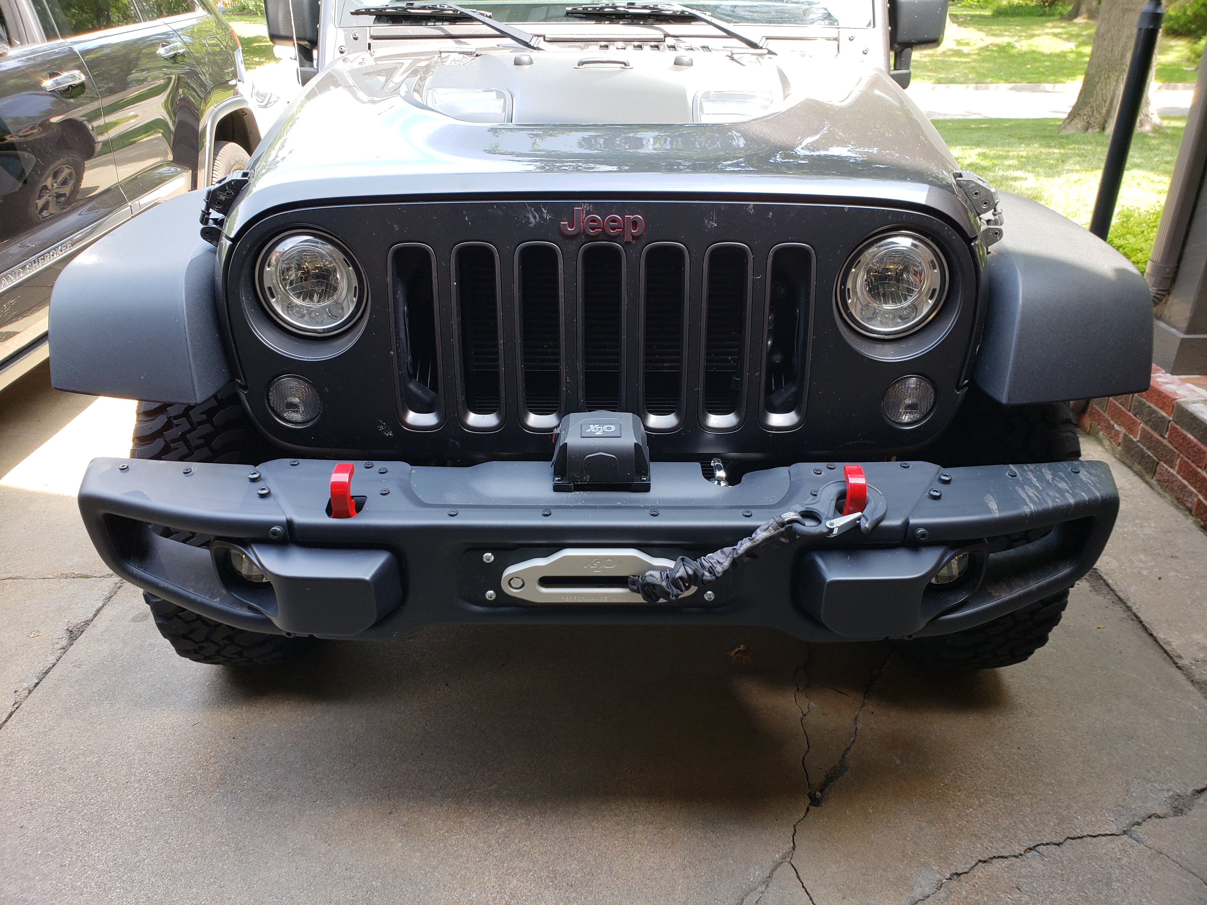 Electric winch components on a Jeep Wrangler front bumper