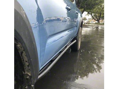 Cali Raised LED Trail Edition Rock Sliders with Kickout; Bed Liner Coating (05-23 Tacoma Double Cab)