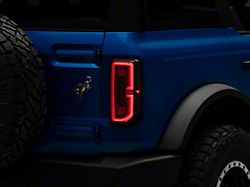 Raxiom Sequential LED Tail Lights; Black Housing; Smoked Lens (21-26 Bronco w/ Factory Halogen Tail Lights)