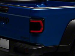 Raxiom Low Profile LED Tail Lights; Black Housing; Smoked Lens (20-25 Jeep Gladiator JT w/ Factory Halogen Tail Lights & w/o Blind Spot Detection))